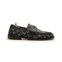 Black cap-toe formal shoe showing sole and details