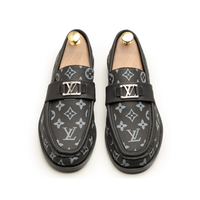 Pair of glossy black cap-toe formal shoes
