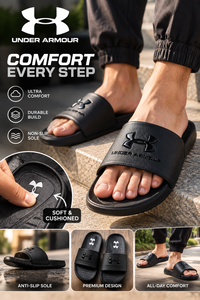Man wearing black Under Armour slides, close-up of cushioned footbed